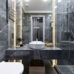 Bathroom with dark marble stone surfaces